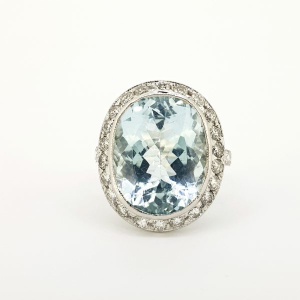22 carat Aquamarine and Diamond Oval Cluster Ring