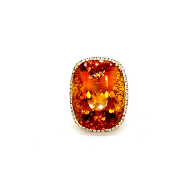 Citrine and Diamond Cluster Cocktail Ring; impressive large 45ct oval cushion-shaped citrine with a delicate 0.40ct diamond surround, in 18ct yellow gold with pierced under-gallery and shoulders