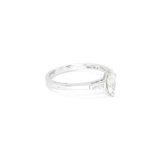 Marquise Cut Diamond Engagement Ring with Baguette Shoulders; central 0.41 carat marquise-cut diamond flanked by tapered baguette-cut diamonds, in 18ct white gold