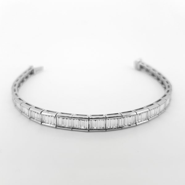 Graduated Baguette Cut Diamond Line Bracelet, 6.02 carat total, 18ct white gold links set with graduating baguette-cut diamonds
