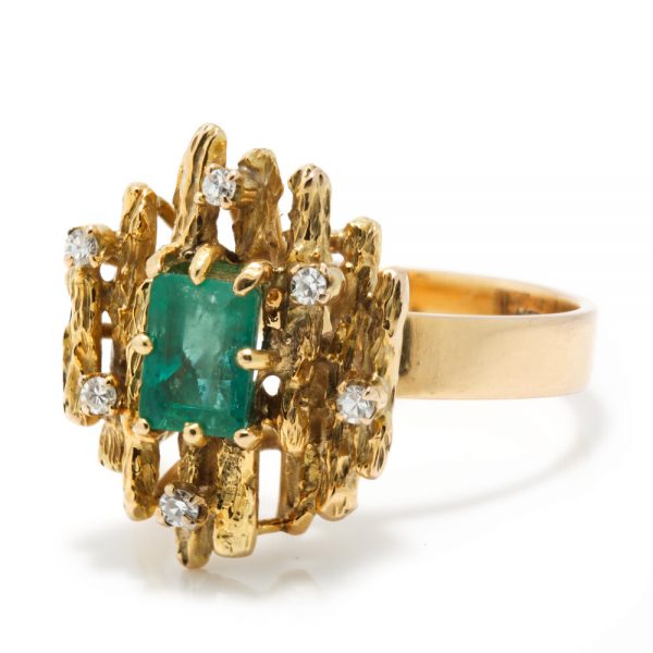 Contemporary Emerald and Diamond Cluster Ring; modernist 14ct yellow gold ring set with a central 1ct emerald decorated with diamonds, Signed KEVIN, Circa 1990s