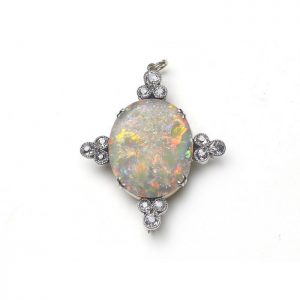 Antique Opal and Diamond Pendant Brooch; claw set oval cabochon-cut opal, with predominantly red play of colour, accented with four groups of three old-cut diamonds set in a trefoil design, in silver and gold. Circa 1900