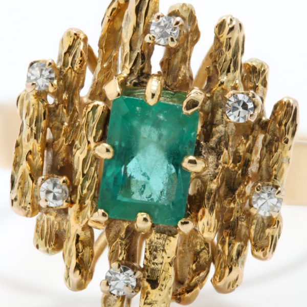 Contemporary Emerald and Diamond Cluster Ring; modernist 14ct yellow gold ring set with a central 1ct emerald decorated with diamonds, Signed KEVIN, Circa 1990s