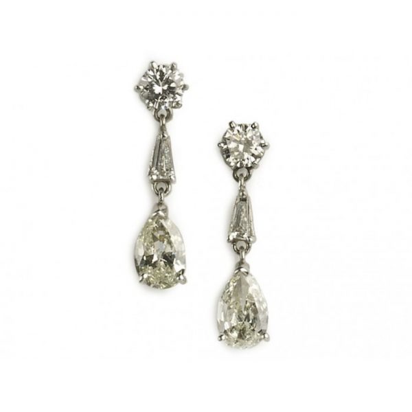 Pear Cut Diamond Drop Earrings in Platinum; round brilliant-cut diamond studs suspend pear shaped diamonds via tapered baguette diamonds, 2.75 carat total