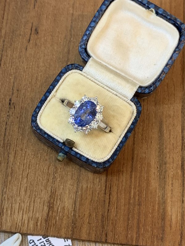 Sapphire and diamond oval cluster engagement ring UK London