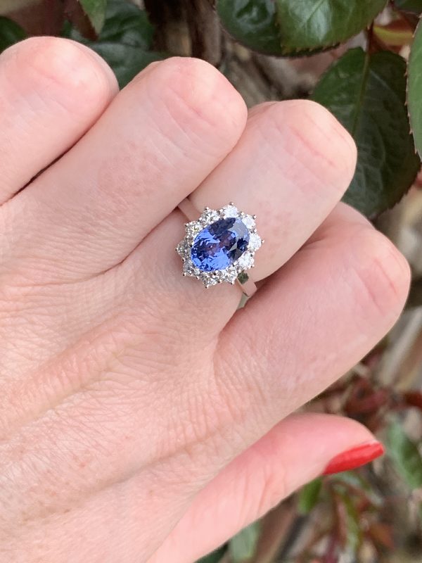 Sapphire and diamond cluster ring engagement oval