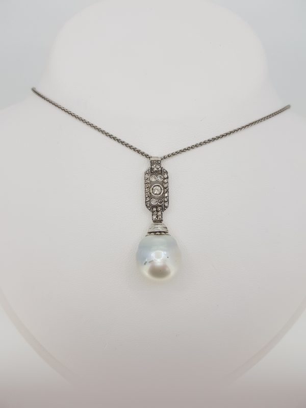 South Sea Pearl and Diamond Pendant; featuring a South Sea pearl suspended from a diamond-set geometric drop, in 18ct white gold