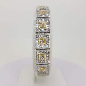 12.80ct Baguette Cut Diamond Link Bracelet; each square link comprises of a central brilliant-cut diamond cluster within a yellow gold setting, all within a baguette-cut diamond surround, in 18ct white gold, 12.80 carat total