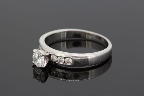 0.45ct Diamond Ring with Channel Set Diamond Shoulders in Platinum