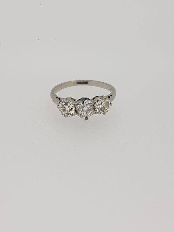Vintage Old Cut Diamond Three Stone Ring in Platinum, 1.20 carat total, featuring three claw-set old-cut diamonds, Circa 1920
