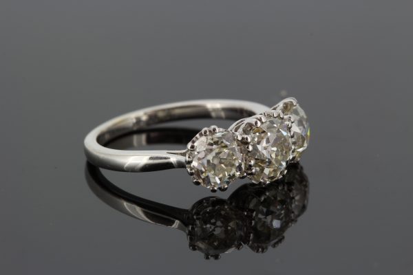 Old Cut Diamond Three Stone Ring, 3.65 carat total; central 1.51ct diamond flanked by 1.07ct diamond either side, in 18ct white gold