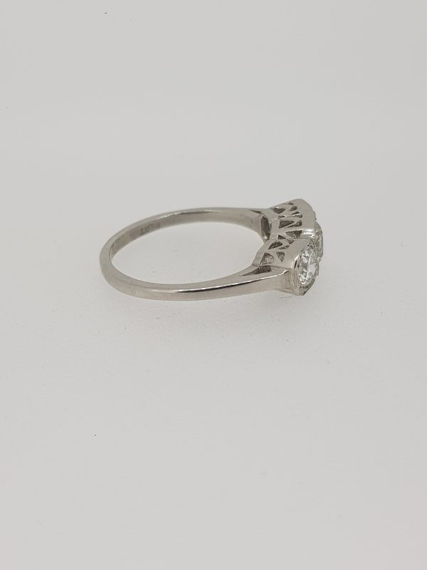 Diamond Three Stone Ring in Platinum, 1.25 carat total, featuring three diamonds set in square collets with delicate millegrain edging