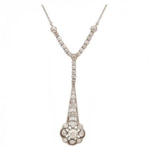 Edwardian Style Old Cut Diamond Floral Cluster Drop Pendant; old-cut diamonds set in an openwork floral cluster drop, suspended from a row of collet set diamonds, 1.00 carat total, mounted in platinum, on an integrated trace chain