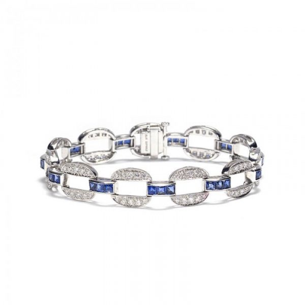 Sapphire and Diamond Oval Link Bracelet in Platinum; oval links set with 1.98cts round brilliant-cut diamonds connected by bars set with 2.99cts princess-cut sapphires
