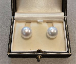 South Sea Pearl Stud Earrings, Signed Assael of New York, button shape 14mm South Sea cultured pearl earrings in 18ct yellow gold by Assael of New York