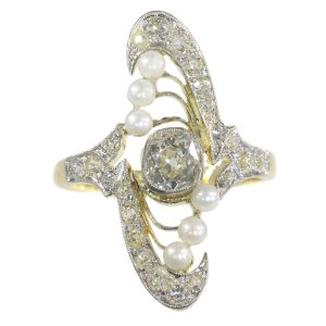 Antique Art Nouveau Diamond and Pearl Navette Cluster Ring; central 0.75ct old European-cut diamond surrounded by 0.73cts old-cut diamonds and 6 pearl accents, Circa 1900