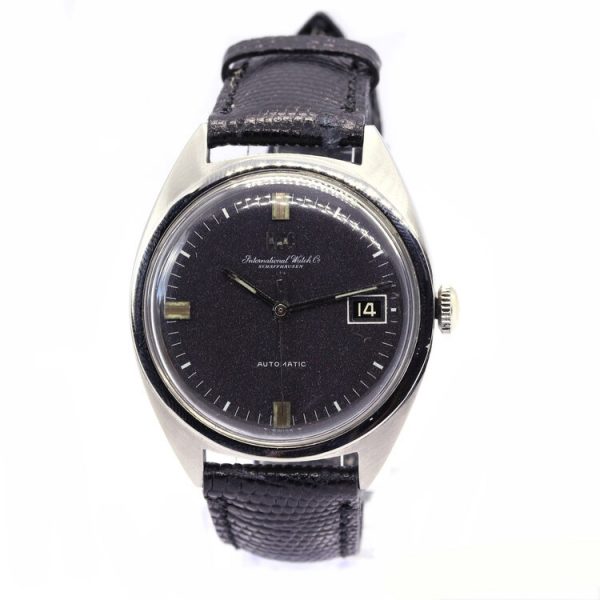 Vintage IWC 36mm Stainless Steel Automatic Watch; round dark grey dial with baton hour markers, date aperture at 3, luminous hands, plexiglass crystal, screw-down case-back, on a black leather strap with steel buckle, Circa 1970s