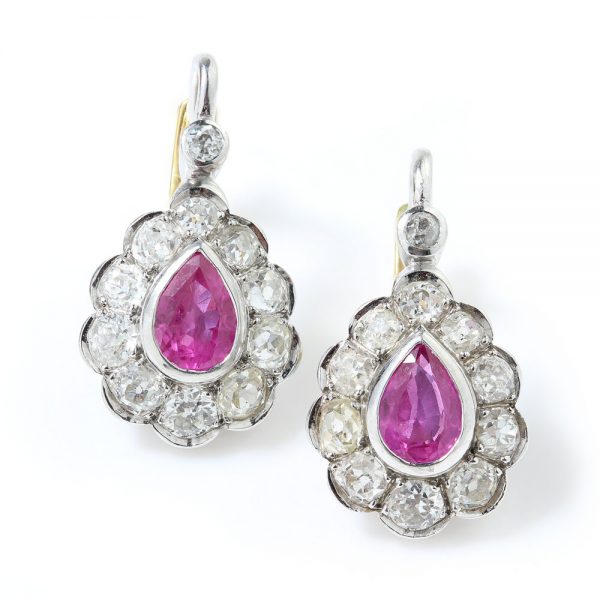 Art Deco Pink Sapphire and Old Cut Diamond Pear Shaped Drop Earrings; 0.80cts pear-cut pink sapphires surrounded by 1.20cts old European cut diamonds, in platinum and 18ct yellow gold