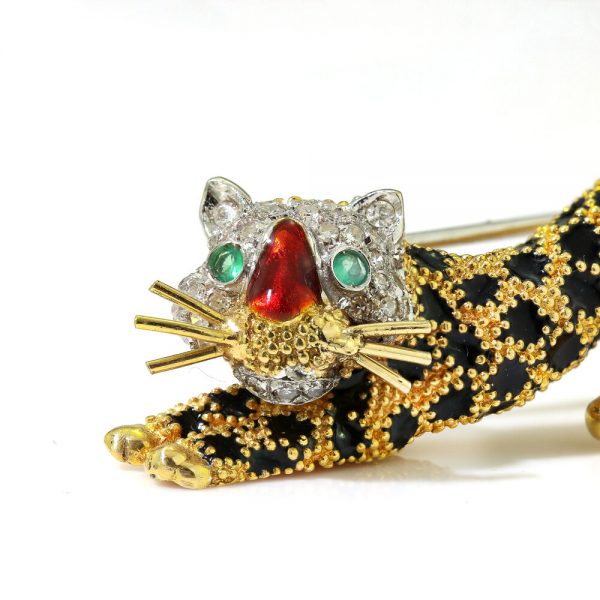 Italian Vintage Gold and Enamel Leopard Brooch; 18ct yellow gold brooch with black enamel spots, red enamel nose, emerald eyes, and diamond face. Circa 1960s by Pierino Frascarolo