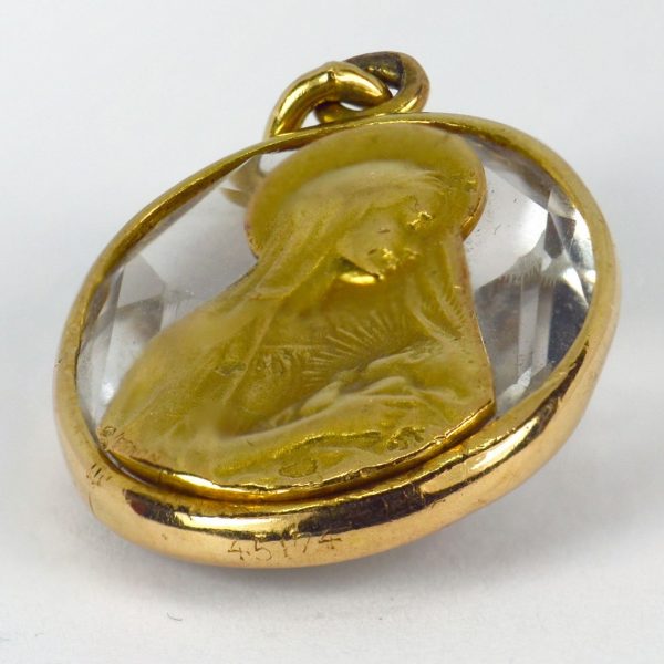 Rock Crystal and 18ct Gold Madonna and Child Charm Pendant; oval faceted rock crystal in a gold frame, with an inset gold plaque depicting the Madonna and child, Signed G. Vernon and numbered 45174