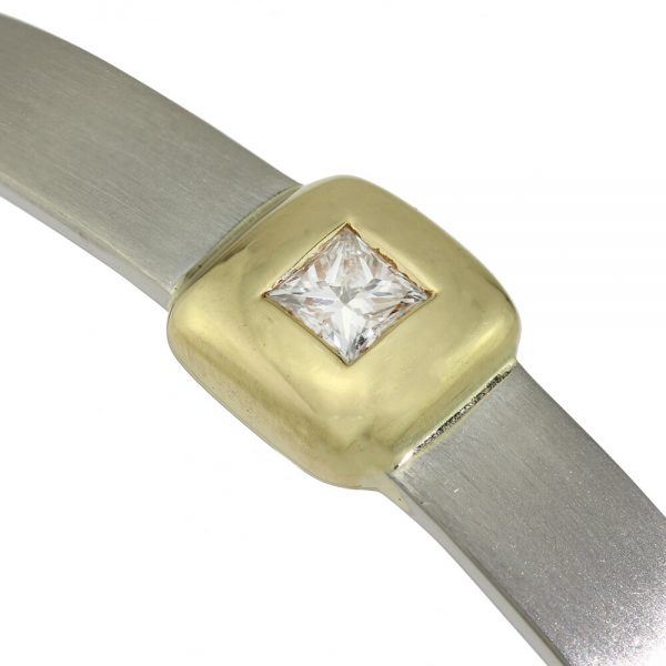 Platinum Bangle Bracelet with Princess Cut Diamond; 0.41ct F VS1 princess-cut diamond in 18ct yellow gold square setting mounted to a platinum bangle, Circa 2000