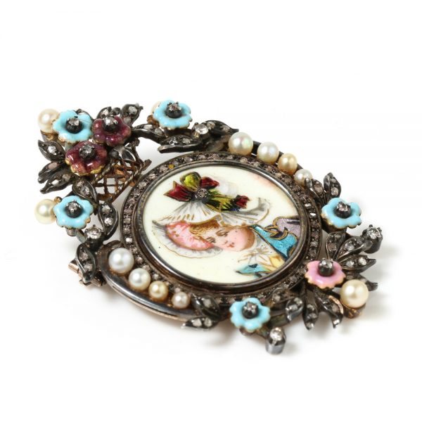 Antique Victorian Enamel Portrait Brooch; enamel portrait of young girl decorated with diamonds, pearls and enamel flowers, in silver and 15ct gold, Circa 1850s