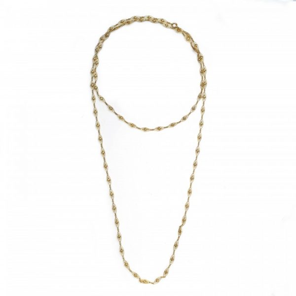 Antique French Gold Long Fancy Link Chain Necklace; fancy openwork navette links spaced by bow-shaped gold links, 18ct yellow gold, Circa 1900