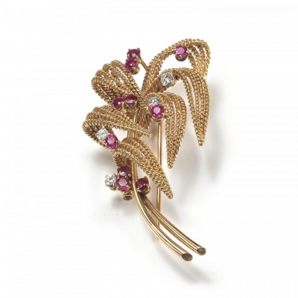 Vintage Boucheron Ruby, Diamond and Gold Floral Spray Brooch; 18ct yellow gold textured leaves set with ten round brilliant-cut rubies and four round brilliant-cut diamonds, Circa 1960