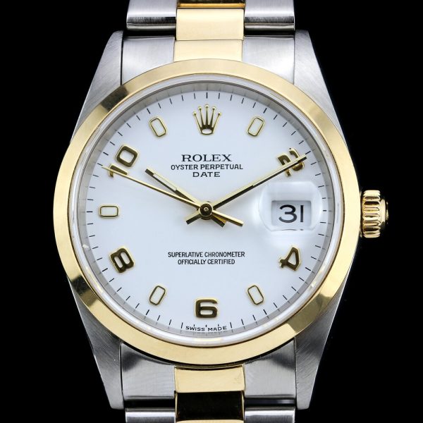 Rolex Oyster Perpetual Date 15203 Steel and Gold 34mm Automatic Watch; white dial with Arabic numerals at 2, 4, 6, 8 and 10, on a steel and gold bracelet strap. Circa 1999-2003