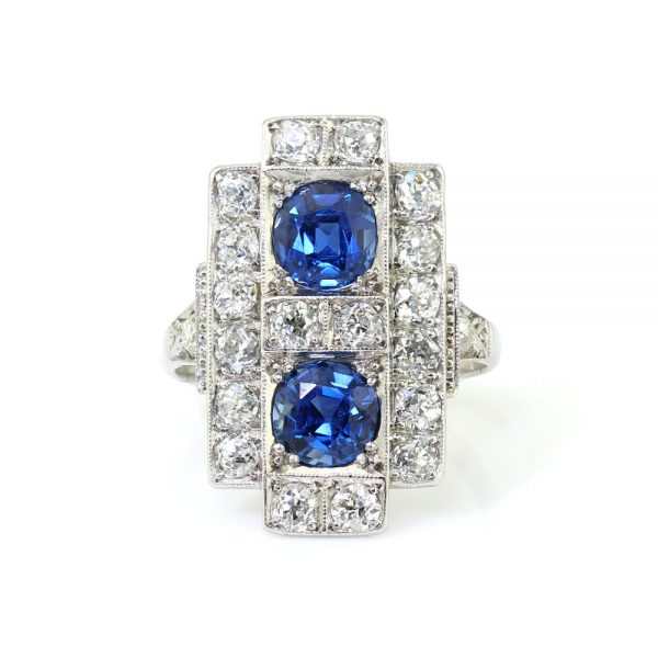 Art Deco Sapphire and Old Cut Diamond Plaque Ring in Platinum; featuring two sapphires totalling 1.50cts within a geometric surround set with 1.40cts old cut diamonds, Circa 1920s