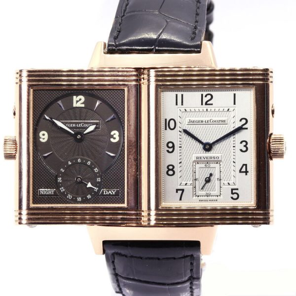 Jaeger LeCoultre Reverso Grande Taille Duoface Day and Night Watch in 18ct Rose Gold; Ref 270.2.54, reversible silver and black dials, manual wind mechanical movement, on a Jaeger-LeCoultre black leather strap with 18ct rose gold single deployant clasp, with Jaeger-LeCoultre box and papers