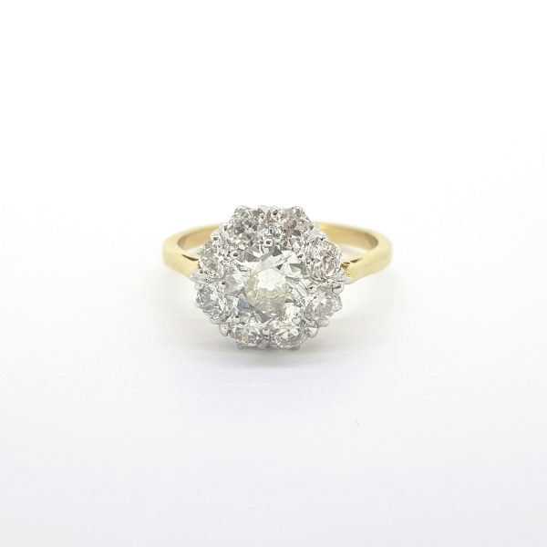 Old Cut Diamond Cluster Ring; central 1ct old-cut diamond encompassed within an old cut diamond surround, 2.00 carat total, in 18ct yellow gold