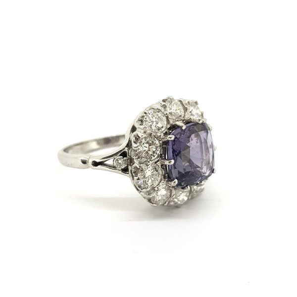 Natural Purple Sapphire and Old Cut Diamond Cluster Ring; featuring a 3.81ct cushion-cut purple sapphire surrounded by 1.70cts old-cut diamonds, in 18ct white gold