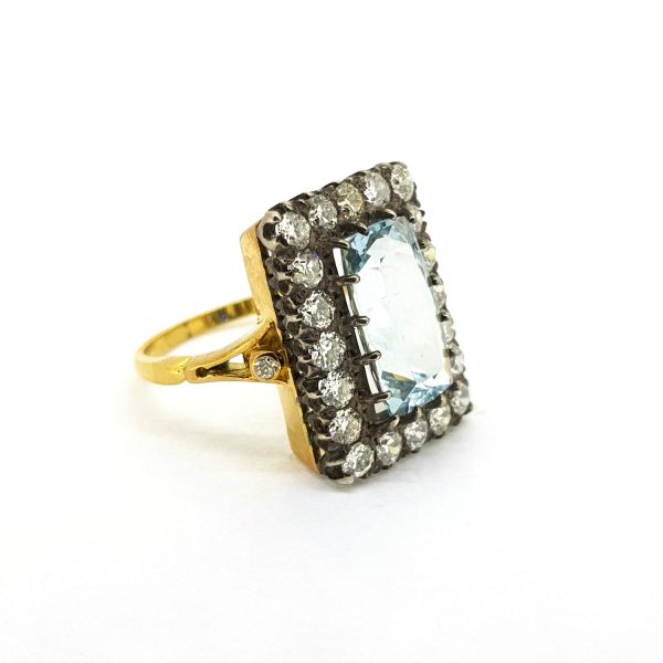 Vintage 4ct Aquamarine and Old Cut Diamond Cluster Ring; central 4ct aquamarine surrounded by 1.40cts old-cut diamonds, in silver and 18ct yellow gold band