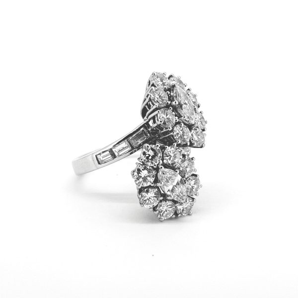 Vintage Double Diamond Cluster Ring, 5.50 carat total, two clusters of marquise cut diamonds surrounded by round brilliant-cut diamonds, baguette-cut diamond-set shoulders, in 18ct white gold, Circa 1970