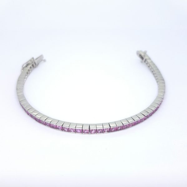 Princess Cut Pink Sapphire Line Bracelet, set with 5 carats of square-cut pink sapphires, in 18ct white gold, 17.7 grams