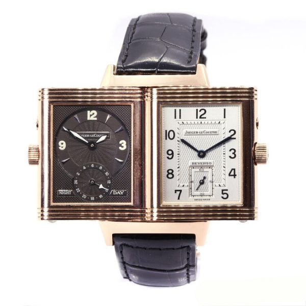 Jaeger LeCoultre Reverso Grande Taille Duoface Day and Night Watch in 18ct Rose Gold; Ref 270.2.54, reversible silver and black dials, manual wind mechanical movement, on a Jaeger-LeCoultre black leather strap with 18ct rose gold single deployant clasp, with Jaeger-LeCoultre box and papers
