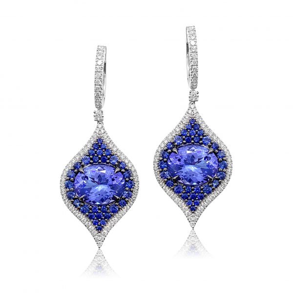 Tanzanite, Sapphire and Diamond Drop Earrings; 6.83cts oval faceted tanzanites framed by 1.44cts blue sapphires, all within 0.88ct diamond set border, in 18ct white gold