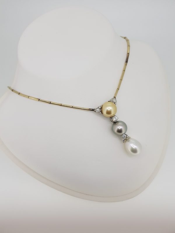 Tri Colour Pearl and Diamond Drop Pendant Necklace; featuring a golden, grey and white pearl suspended in a line accented with 1cts diamonds