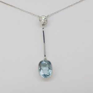 Aquamarine and Diamond Drop Pendant; featuring a 5ct cushion-shaped oval aquamarine suspended from a 0.60ct brilliant-cut diamond via a gold bar, 18ct white gold