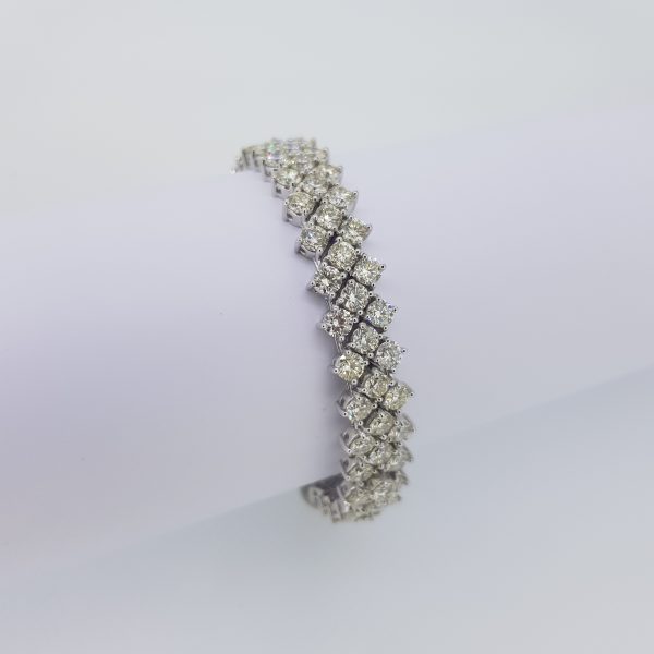 Fine Diamond Bracelet in 18ct White Gold, 19.63 carat total, comprised of three rows of brilliant-cut diamonds claw-set in 18ct white gold