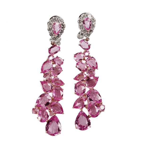 Pink Sapphire and Diamond Drop Earrings; pear cut pink sapphire and diamond cluster tops suspending detachable cascades of pink sapphires, in 18ct gold. English, Circa 1990. Pink sapphires 13 carats, Diamonds 1.25 carats