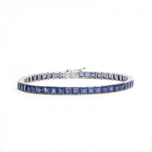 Princess Cut Sapphire Line Bracelet in Platinum, channel set with 8.84cts square-cut sapphires, with tongue clasp and figure-of-eight safety catch
