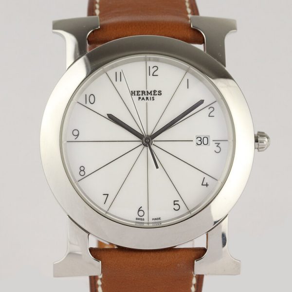 Hermes Heure H Ronde HR1.710 Steel 40mm Quartz Watch; white dial with Arabic numerals, date indicator and sapphire crystal, on a brown leather strap, with Hermes box and papers