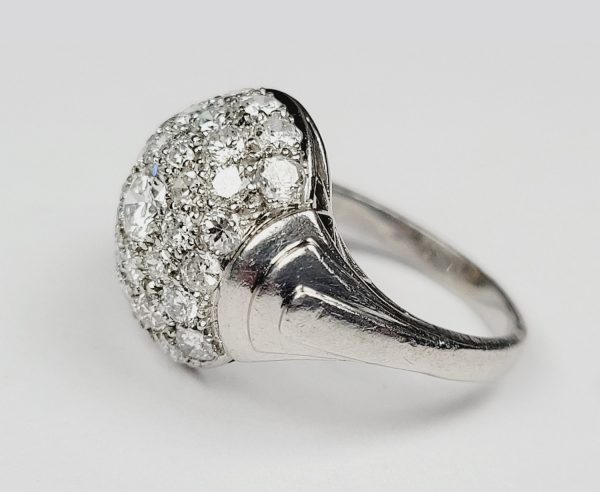 Art Deco Diamond Cluster Bombe Ring; central 0.33ct diamond within a triple border surround of sparkling diamonds, 2.95 carat total, in platinum with graduating stepped shoulders