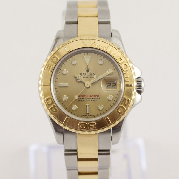 Rolex Yacht Master 169623 Ladies 29mm Steel and Gold Automatic Watch; champagne/gold colour dial with yellow gold rotating bezel, date indicator and sapphire crystal, on a steel and gold Oyster bracelet with steel and gold fold-over clasp, with Rolex box and papers