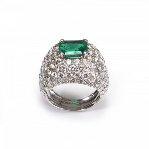 Emerald and Diamond Bombe Cluster Ring, central 2.40ct emerald-cut emerald surrounded by 6cts of brilliant-cut diamonds in a pavé setting, in 18ct white gold