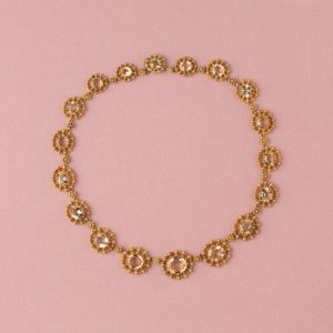 Antique Gold and Topaz Cluster Necklace; set with eighteen graduating oval topaz, each richly decorated with 18ct yellow gold cannetille and granulation, France, Circa 1840