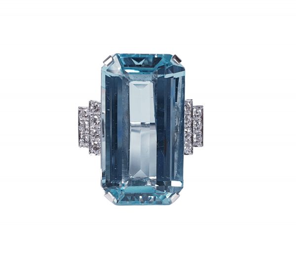 Art Deco 25ct Aquamarine and Diamond Dress Ring in Platinum; central 25 carat aquamarine set with geometric stepped diamond shoulders, Circa 1920