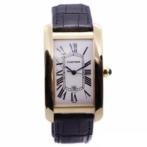 Cartier Tank Americaine 18ct Yellow Gold Large Model 1740 Automatic Watch, ref 1740, silvery-white dial with Roman numerals, date aperture at 6 o'clock, sapphire crystal glass and faceted blue gemstone set crown, on a Cartier black leather strap, with an 18ct yellow gold single deployant clasp, in a Cartier presentation box